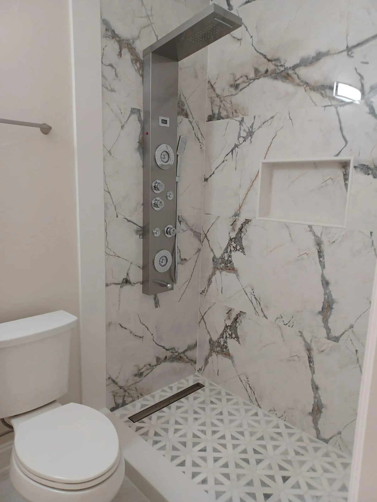 Marble shower with multi-jet shower panel system