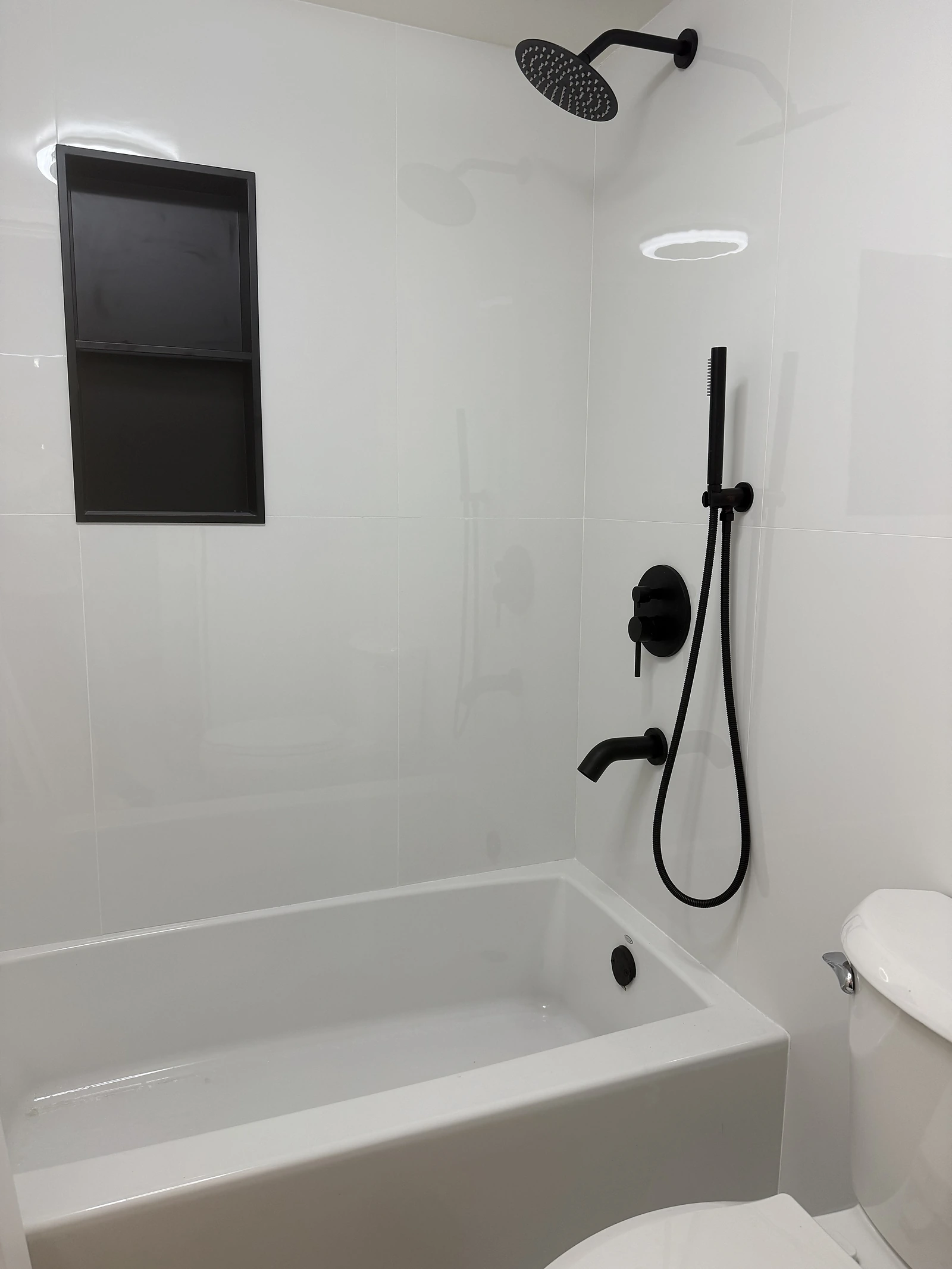 White tub-shower combination with matte black fixtures — Pompano Beach, FL