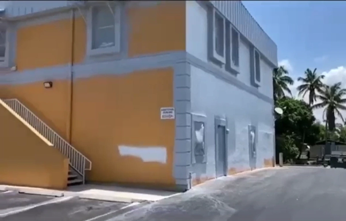 Repainted home exterior with weather-resistant coating