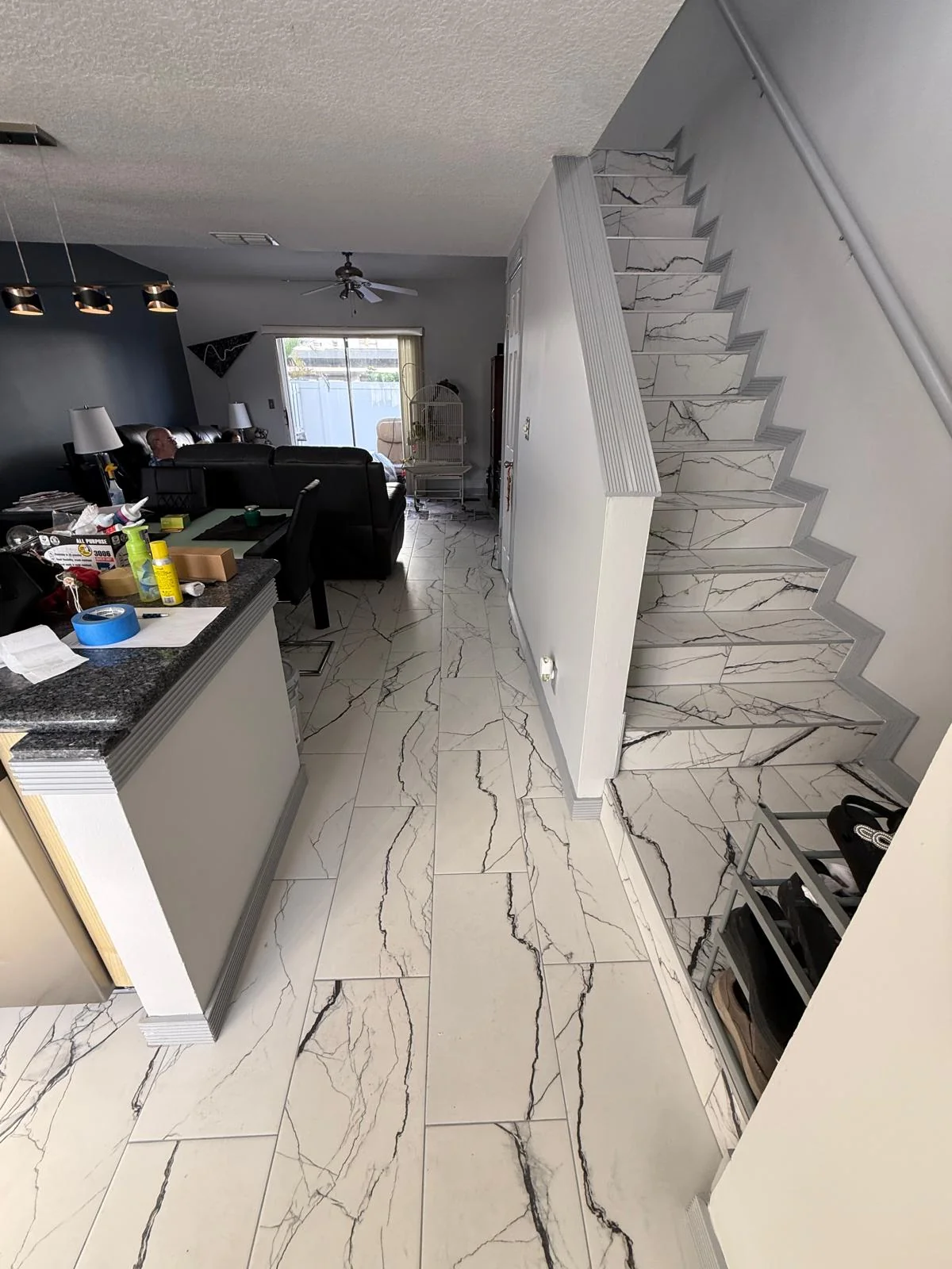 Marble-look porcelain flooring continuing up the staircase